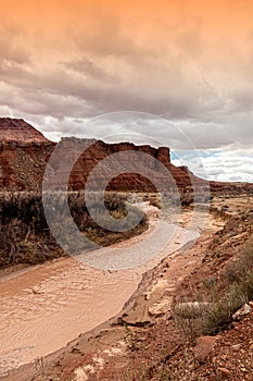 Rugged landscape and the brown river, Lees Ferry landing, Page, AZ, USA