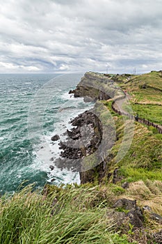 Rugged landscape and coastal walkway on Jeju Island
