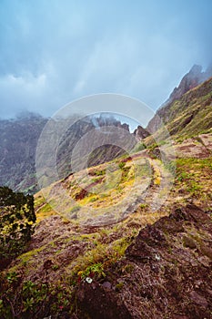 Rugged mountain range overgrown with verdant grass and encase by fog . Xo-Xo Valley. Santo Antao Island, Cape Verde Cabo