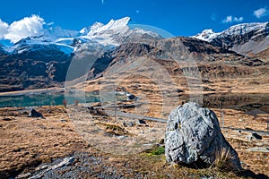 Rugged mountain scenery and lake near Bernina Pass, Switzerland