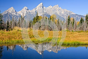 Rugged Mountains Reflecting in Calm River photo
