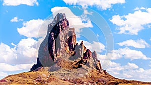 The rugged peaks of El Capitan and Agathla Peak towering over the desert landscape south of Monument Valley