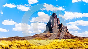 The rugged peaks of El Capitan and Agathla Peak towering over the desert landscape south of Monument Valley