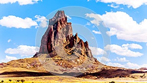 The rugged peaks of El Capitan and Agathla Peak towering over the desert landscape south of Monument Valley