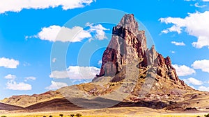 The rugged peaks of El Capitan and Agathla Peak towering over the desert landscape south of Monument Valley