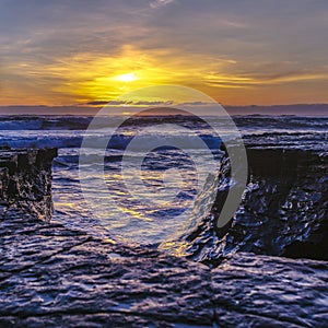 Rugged rocks by the sea in La Jolla at sunset