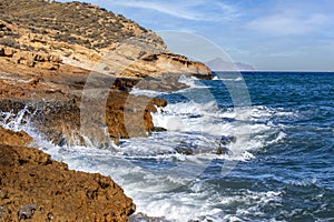 Rugged, rocky coast with surf in Cabo Cope and Puntas de Calnegre Regional Park photo