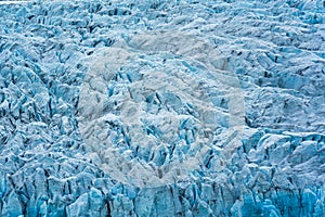 Rugged textured natural blue iceberg in Fjallsarlon iceberg lagoon