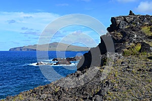 Rugged volcanic cliffs and coastline in Rapa Nui island Easter Island