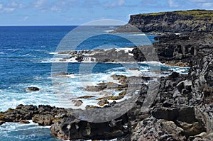 Rugged volcanic cliffs and coastline in Rapa Nui island Easter Island