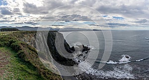 Rugged and wild coastline in northern Spain with cliffs and rocky beach