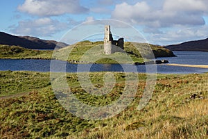 The Ruin of 16th Century Ardvreck Castle sat on a Rocky Promontory in Loch Assynt, Sutherland, Scotland, UK