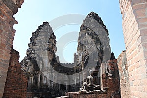 Ruin of ancient Buddha at Phra Prang Sam Yot in Lopburi during the daytime, Thailand.