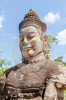 Ruin bayon stone face at gateway of Angkor Wat, Siem Reap, Cambodia.