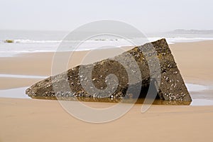 Ruin blockhaus in sand beach in french atlantic coast sign second world war photo