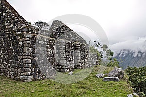 Ruin with fog on the Inca Trail to Machu Picchu. A awesome hiking trail with hight mountain pass and mountain ranges. Green Fores