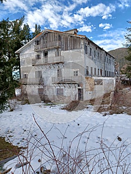 The ruin of an old hotel in the snow
