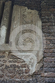 Ruin of stone wall and stone relief, Thailand