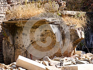 Ruin structure, debris scattered scene in rural village in India. Wreckages of building