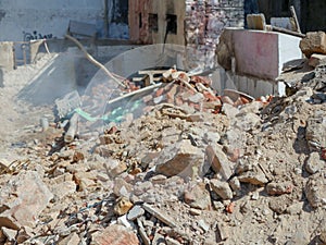 Ruin structure, debris scattered scene in rural village in India. Wreckages of building