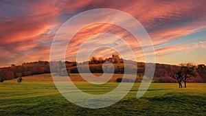 Ruin on top of a hill at autumn sunset