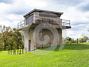 A ruin of a tower at Fort Washington, Virginia, with the sun shining on the fall colored background