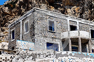 A ruined and abandoned building in the mountains photo