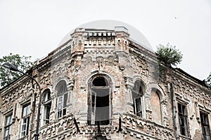 Ruined abandoned house. Ancient ruined house with arched windows