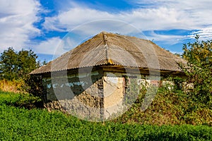 Ruined and abandoned rural house. The concept of a dying village and global urbanization. Background with copy space