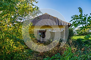 Ruined and abandoned rural house. The concept of a dying village and global urbanization. Background with copy space