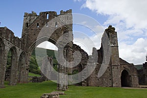 Ruined abbey walls and arches in Brecon Beacons in Wales