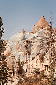 Ruined and ancient cave house in Cappadocia mountain landscape