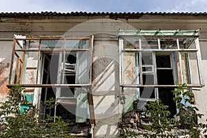 ruined balcony on the top floor of an abandoned house