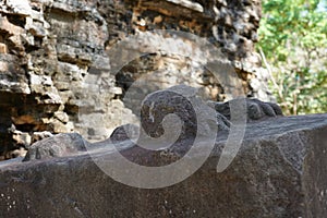 Ruined base of lion statue legs at Prasat Tao in Sambor Prei Kuk in Cambodia