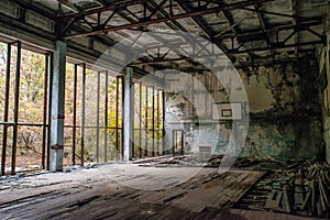 Ruined basketball indoors court in the abandoned school building located in the Chernobyl ghost town