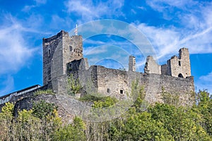 Ruined Brandenburg Castle on a promontory surrounded by small green trees