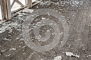 A ruined building with broken glass windows