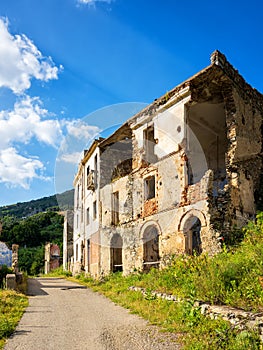 Ruined buildings of an abandoned city. Architecture of a ghost town