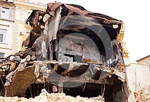 Ruined burnt down house with an old sofa in the rest of the room. Odessa city center, De Volan street local people call