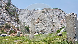 The ruined column in the outdoor mountain scene