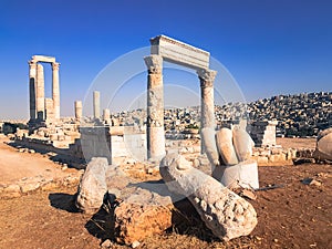 Ruined columns. Hercules hand at the historic park in Amman. Roman civilization.