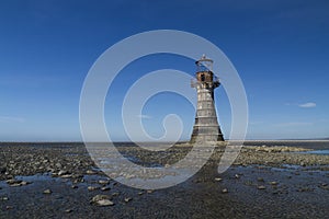 Ruined derelict lighthouse, space to top left. Whiteford Sands,