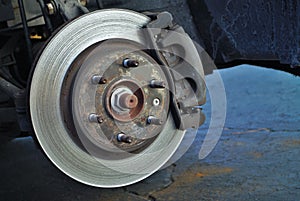 Ruined disc brake rotor seen on a vehicle