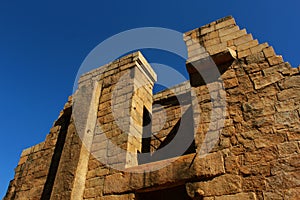 Ruined facade wall with sky of the ancient Brihadisvara Temple in Gangaikonda Cholapuram, india.