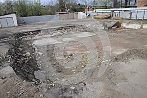 ruined foundation of an old building, the walls of the basement of a demolished building and debris