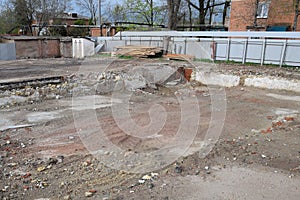 ruined foundation of an old building, the walls of the basement of a demolished building and debris