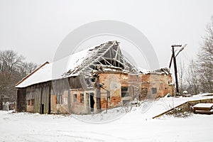 Ruined house with destroyed roof