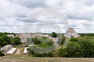 The ruined Nunnery Quadrangle and The Pyramid of Magician, Uxmal, Yucata, Mexico