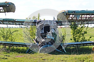 Ruined old Antonov An-2, a Soviet mass-produced single-engine biplane aircraft on an airplane cemetery