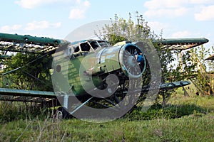 Ruined old Antonov An-2, a Soviet mass-produced single-engine biplane aircraft on an airplane cemetery